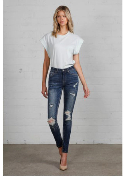 Dark distressed skinny jeans